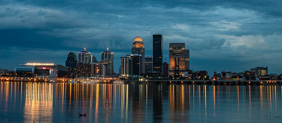 City skyline reflected in a river at night