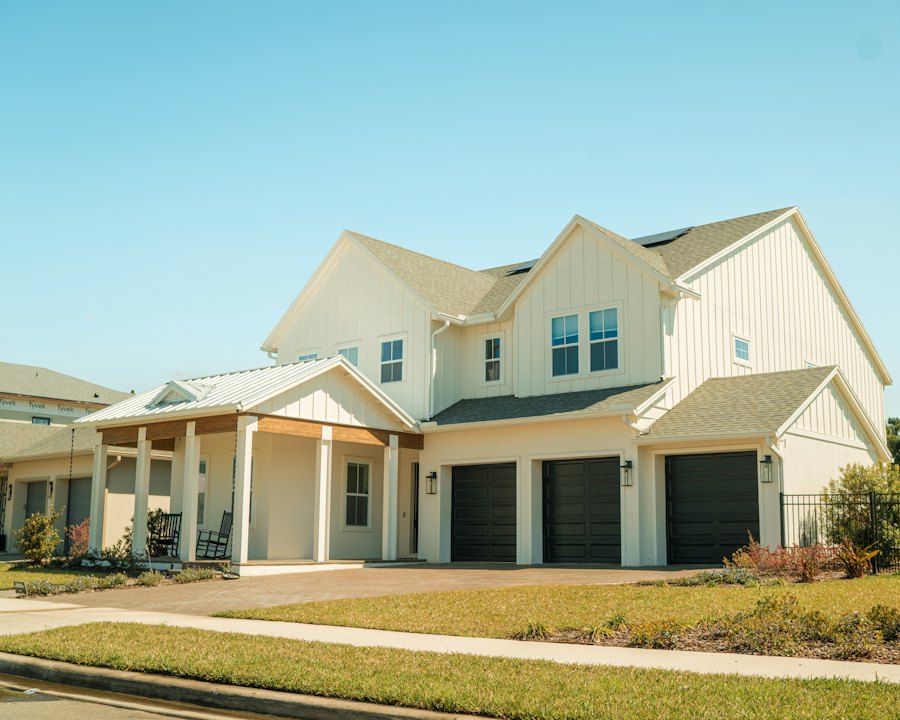 Modern farmhouse-style two-story home with a three-car garage