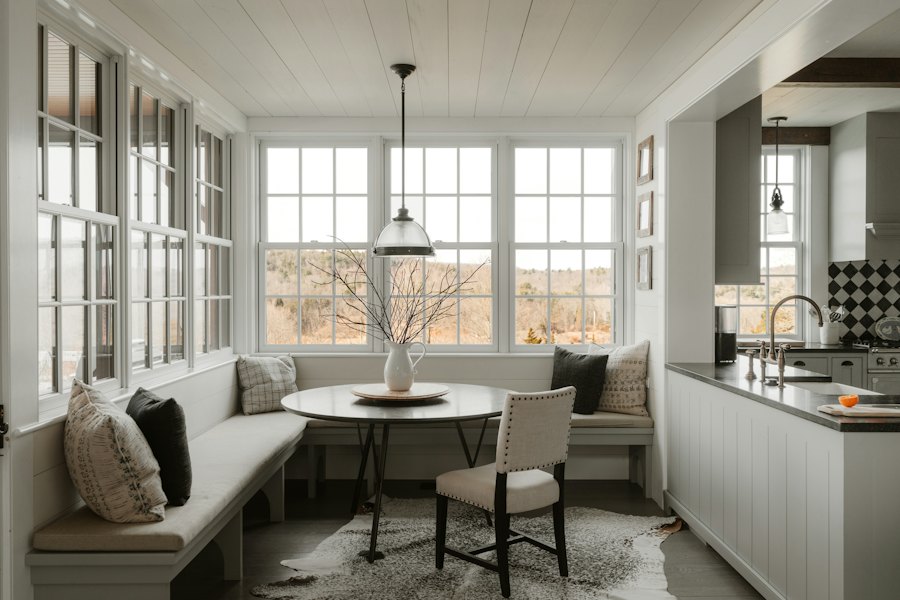 Breakfast nook with built-in bench seating and large windows