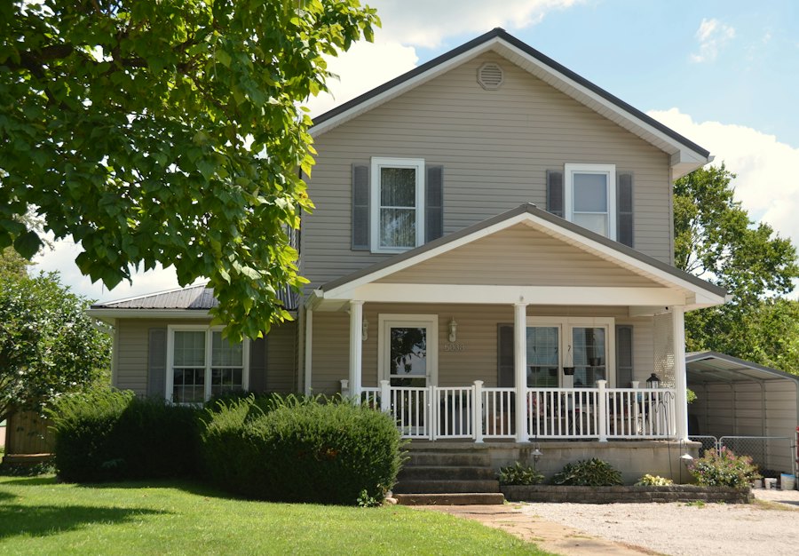 Two-story house with a wraparound covered front porch